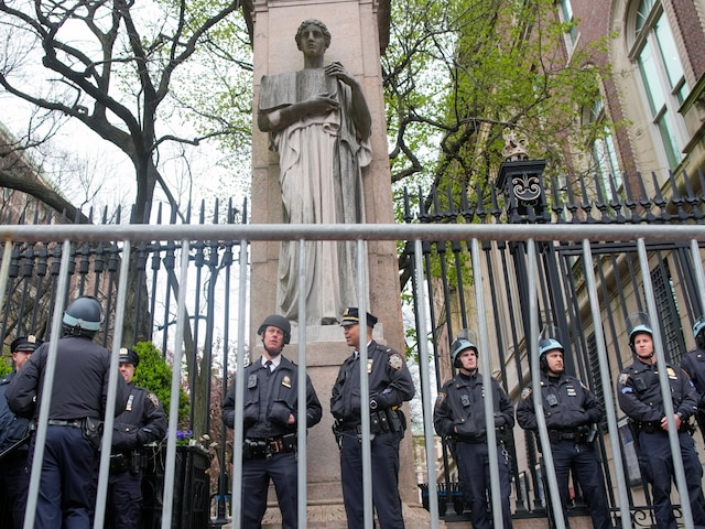 New York City police in riot gear stand guard outside the Columbia University campus after clearing the campus of protesters, April 18, 2024, in New York. (AP file)