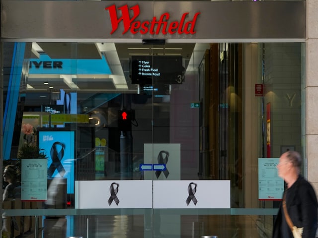 A man walks past the entrance to the Westfield mall at Bondi Junction in Sydney, Thursday, April 18, 2024. (AP Photo/Mark Baker)
