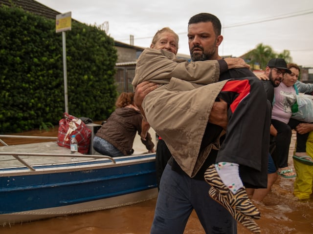 People are evacuated from a flooded area in Porto Alegre, Rio Grande do Sul State, Brazil. (Image: AFP)