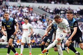 Tottenham Hotspur's James Maddison shoots under pressure during the English Premier League soccer match between Tottenham Hotspur and Burnley, at the Tottenham Hotspur Stadium, London, Saturday May 11, 2024. (John Walton/PA via AP)