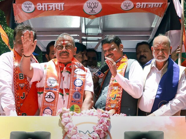 BJP candidate from Mumbai North Central constituency Ujjwal Nikam with Maharashtra Deputy Chief Minister and party leader Devendra Fadnavis during his nomination rally for Lok Sabha polls in Mumbai, on May 3 2024. (PTI)
