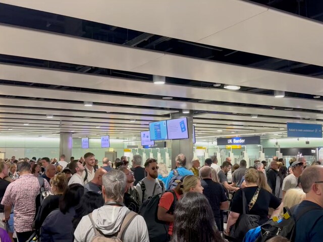 People wait in line at Heathrow airport, after the Border Force suffered a nationwide technical issue that affected passport control, in London, May 7, 2024. (Reuters)
