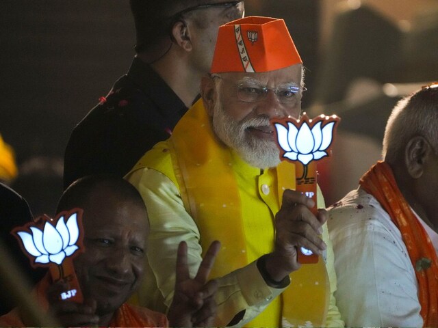 PM Narendra Modi during a roadshow for Lok Sabha elections. (IPTI)