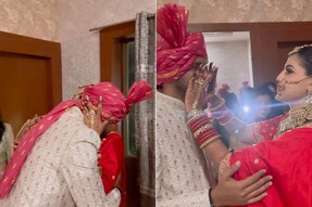 Brother emotionally hugs his sister after seeing her as a bride.