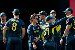 Australia's Adam Zampa, center, celebrates with teammates after taking the wicket of England's captain Jos Buttler during an ICC Men's T20 World Cup cricket match at Kensington Oval in Bridgetown, Barbados, Saturday, June 8, 2024. (AP Photo/Ricardo Mazalan)