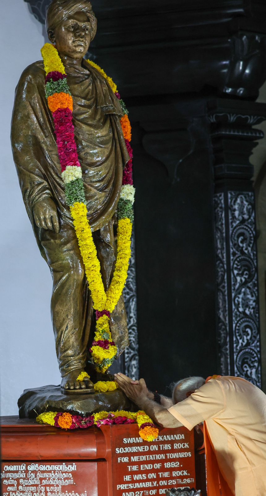Clad in saffron, PM Modi paid floral tributes to a statue of Swami Vivekananda. Clad in saffron, PM Modi paid floral tributes to a statue of Swami Vivekananda.