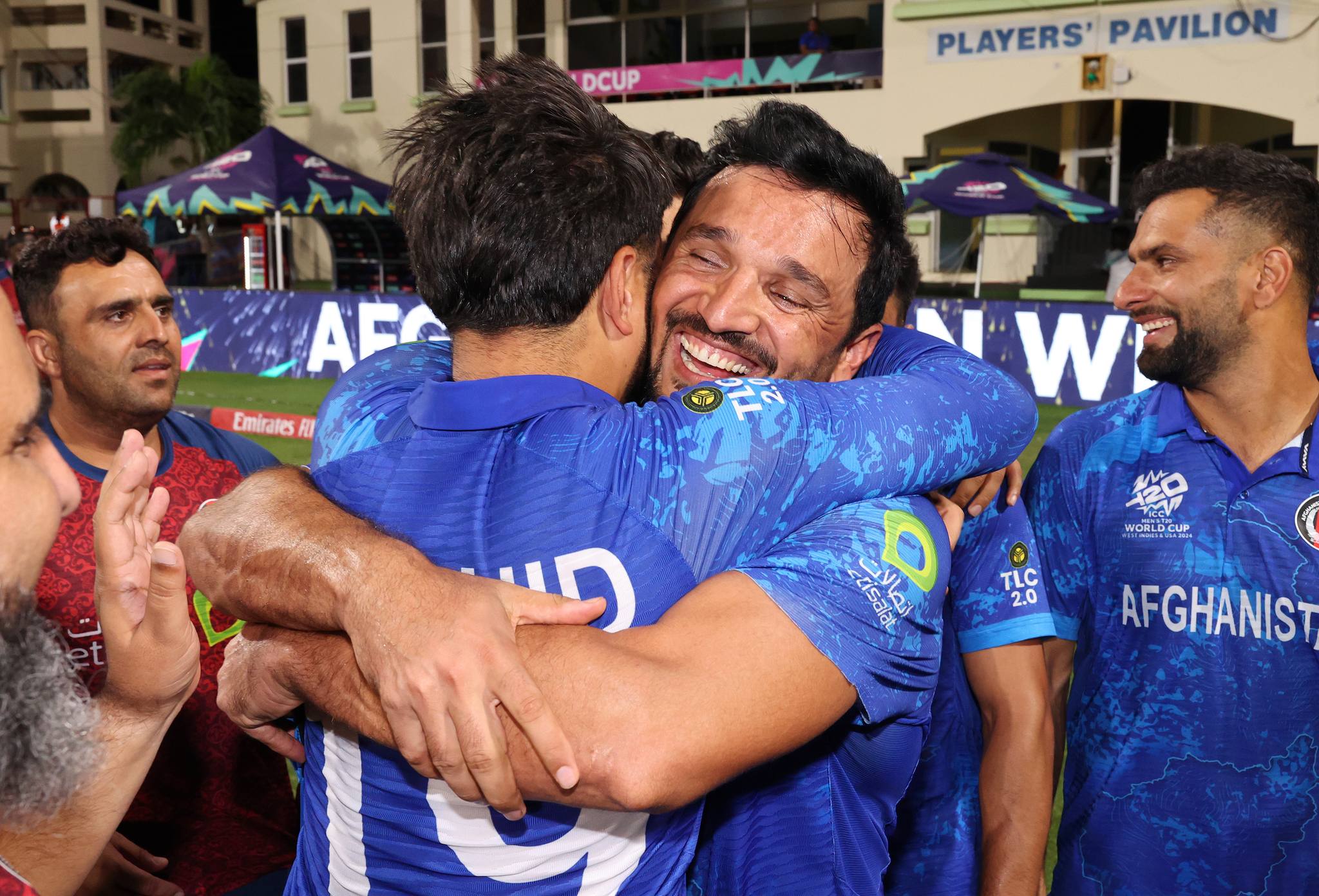 Gulbadin Naib embraces teammate skipper Rashid Khan after Afghanistan's victory against Bangladesh at Arnos Vale Ground on June 24, 2024. (ICC/Getty) Gulbadin Naib embraces teammate skipper Rashid Khan after Afghanistan's victory against Bangladesh at Arnos Vale Ground on June 24, 2024. (ICC/Getty)