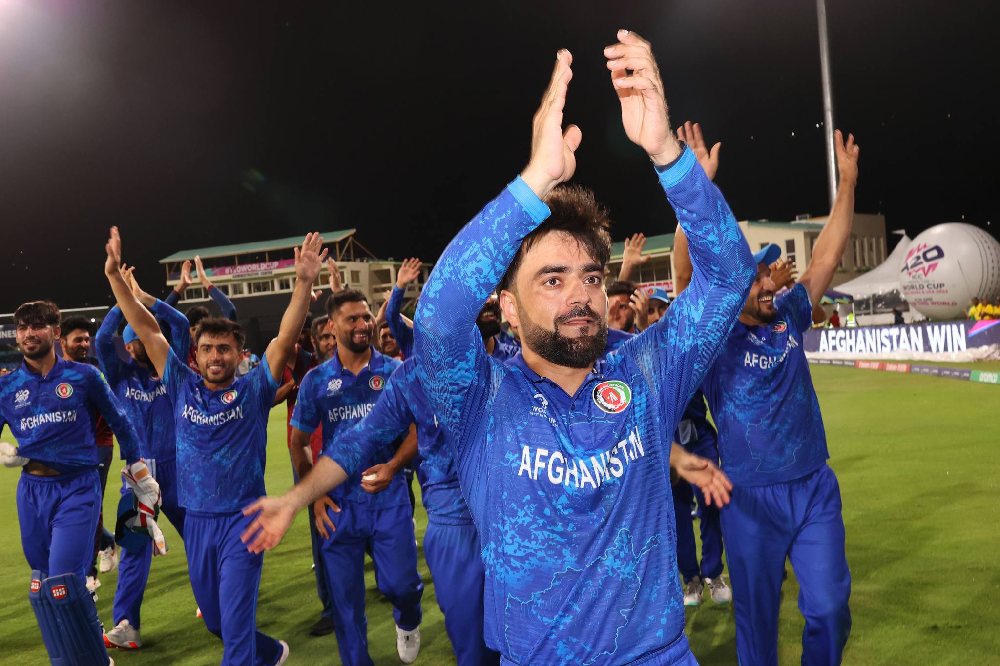 Rashid Khan and his Afghanistan teammates acknowledge the fans after the team's victory. They zoom around the ground clapping and cheering. (ICC/Getty) Rashid Khan and his Afghanistan teammates acknowledge the fans after the team's victory. They zoom around the ground clapping and cheering. (ICC/Getty)
