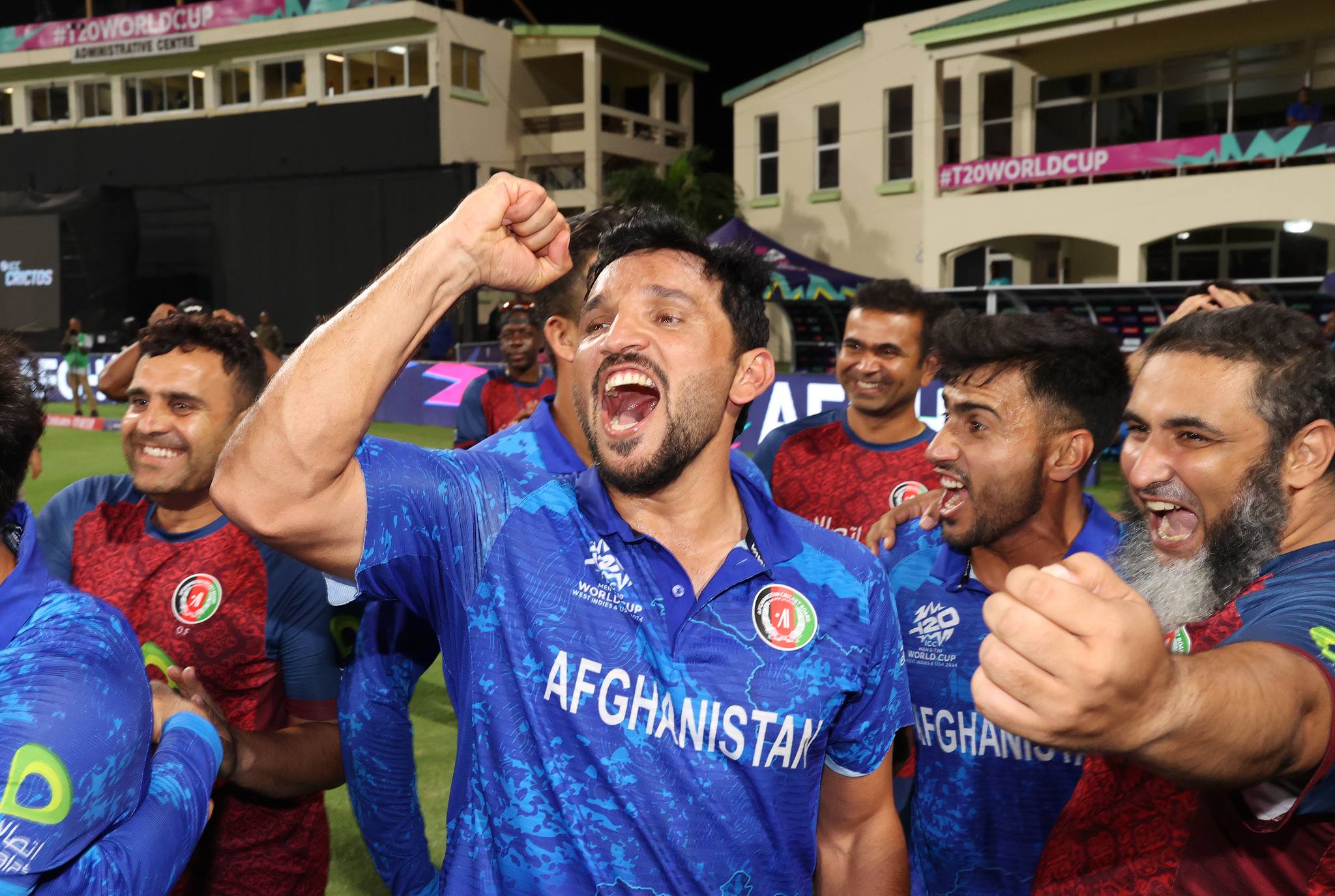 Gulbadin Naib cheers with teammates after the team's victory as they look forward to the June 27 semi-finals against South Africa. (ICC/Getty) Gulbadin Naib cheers with teammates after the team's victory as they look forward to the June 27 semi-finals against South Africa. (ICC/Getty)