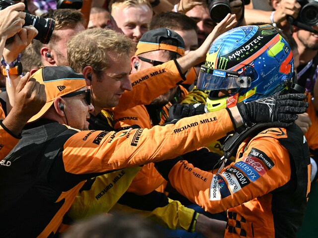 Oscar Piastri celebrating his maiden GP win with his McLaren teammates (AFP)