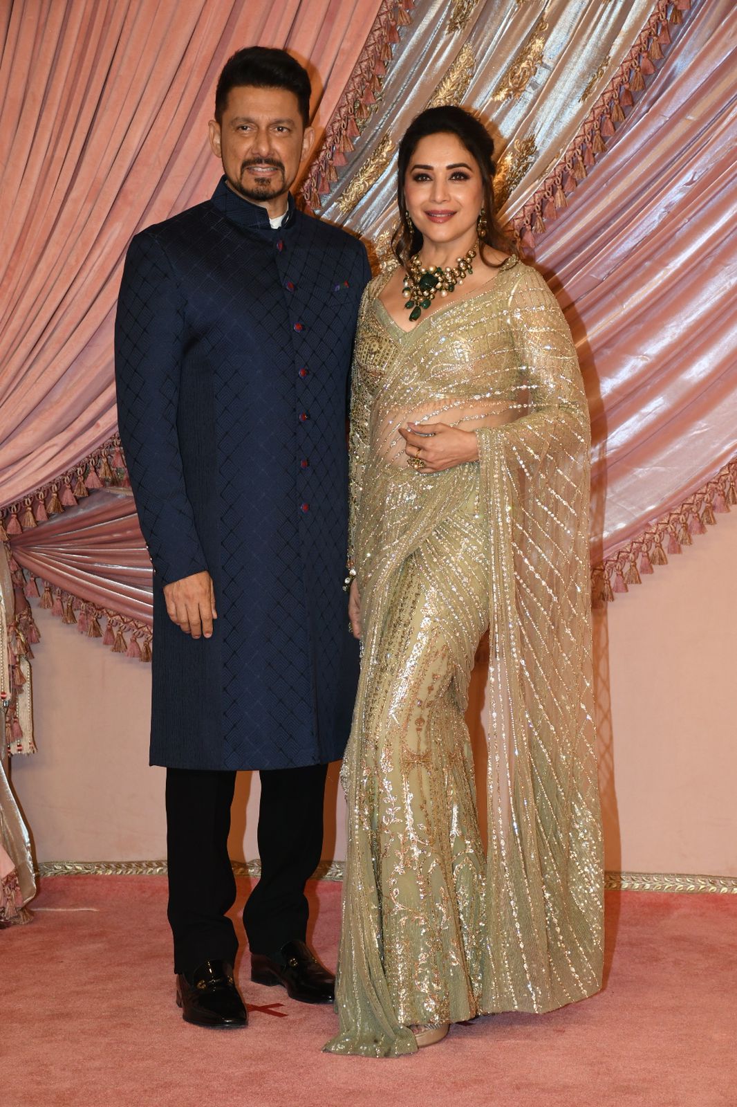 Madhuri Dixit and Dr Ram Nene made a dazzling entry at the sangeet ceremony. (Image: Viral Bhayani) Anant Ambani Radhika Merchant sangeet