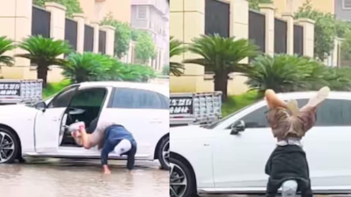 Watch: Man Walks On His Hands In Waterlogged Street To Saves His Shoes