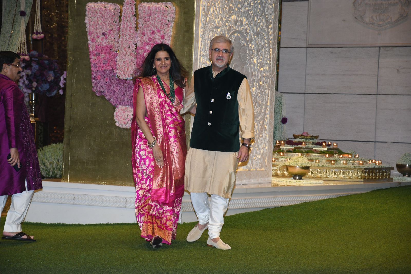 Radhika Merchant's mom and dad pose outside Antilia as they arrive for the special puja held for Anant-Radhika. (Photo: Viral Bhayani) Radhika Merchant's mom and dad pose outside Antilia as they arrive for the special puja held for Anant-Radhika. (Photo: Viral Bhayani)