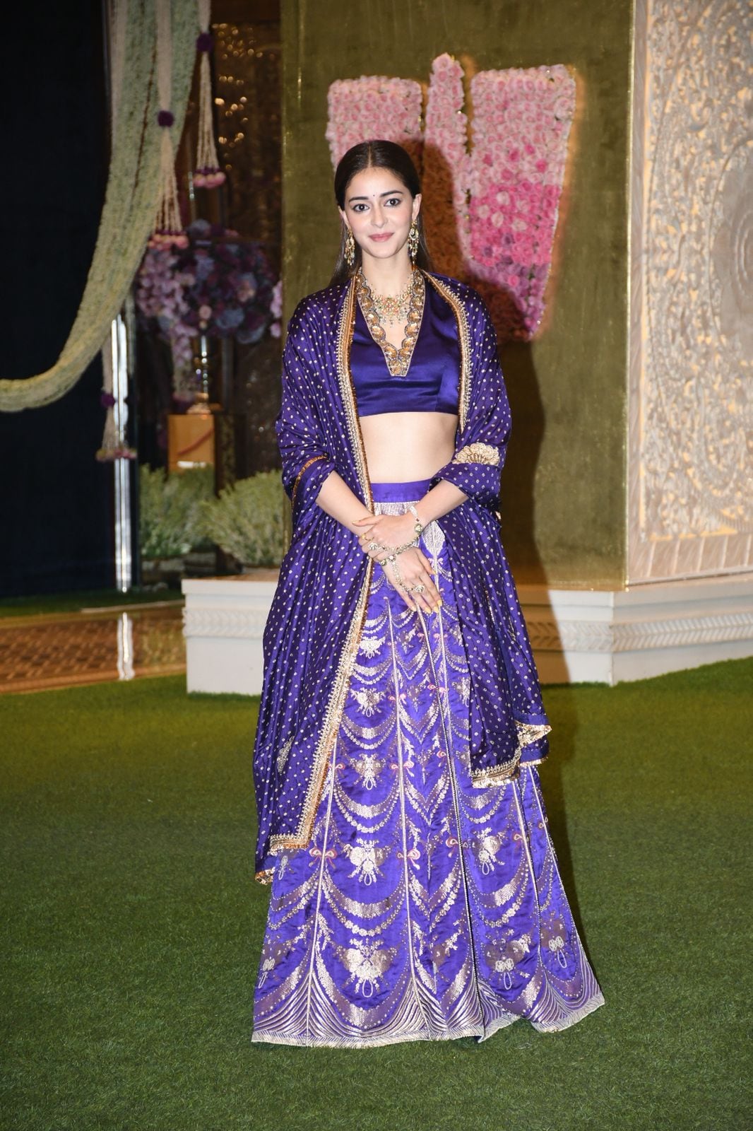 Ananya Panday dazzles in a purple lehenga by Raw Mango. The satin V-neck blouse, embellished skirt, and golden jewelry make her natural beauty shine through. (Photo: Viral Bhayani) Ananya Panday dazzles in a purple lehenga by Raw Mango. The satin V-neck blouse, embellished skirt, and golden jewelry make her natural beauty shine through. (Photo: Viral Bhayani)