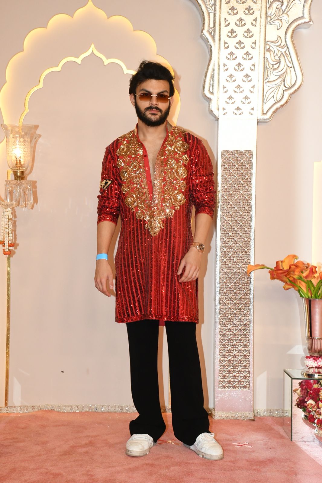 Veer Pahariya looks dashing in a sparkly red striped kurta, paired with black pants and white sneakers. (Image: Viral Bhayani) Veer Pahariya looks dashing in a sparkly red striped kurta, paired with black pants and white sneakers. (Image: Viral Bhayani)