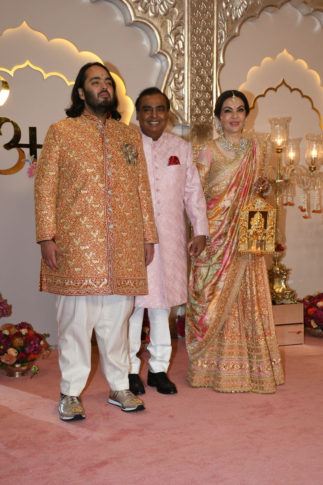 Nita and Mukesh Ambani pose with their youngest son and groom-to-be Anant Ambani before the wedding. (Image: Viral Bhayani) Nita and Mukesh Ambani pose with their youngest son and groom-to-be Anant Ambani before the wedding. (Image: Viral Bhayani)
