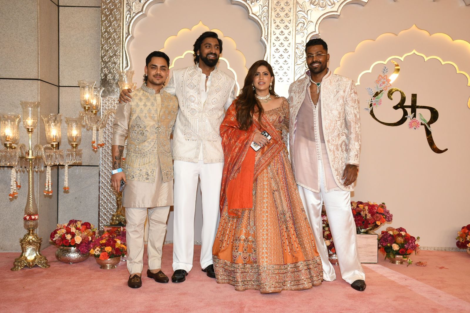 Hardik Pandya looks dapper as he poses with brother Krunal, sister-in-law Pankhuri, and Ishan Kishan. (Image: Viral Bhayani) Hardik Pandya looks dapper as he poses with brother Krunal, sister-in-law Pankhuri, and Ishan Kishan. (Image: Viral Bhayani)