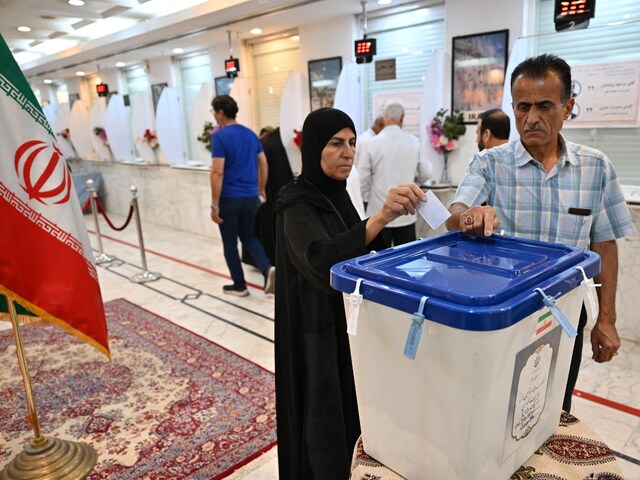 Iran Holds Runoff Presidential Vote Pitting Hard Line Former Negotiator