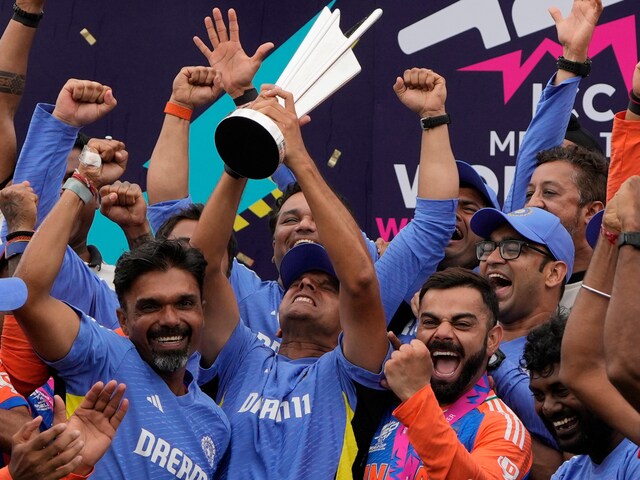 Rahul Dravid celebrates with the T20 World Cup trophy. (AP Photo)