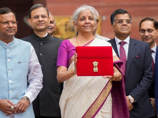 Sitharaman Again Takes Tablet In Red Pouch To Present Paperless Budget Sitharaman Again Takes Tablet In Red Pouch To Present Paperless Budget