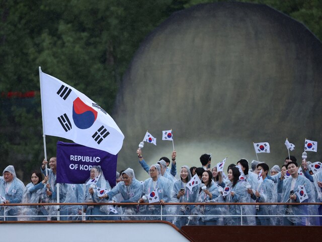  Athletes of South Korea aboard a boat in the floating parade on the river Seine during the opening ceremony. REUTERS/File Photo