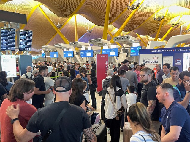 Passengers wait at Barajas Airport after the Microsoft outage causing flight delays, in Madrid, Spain, July 19. Pic/Reuters