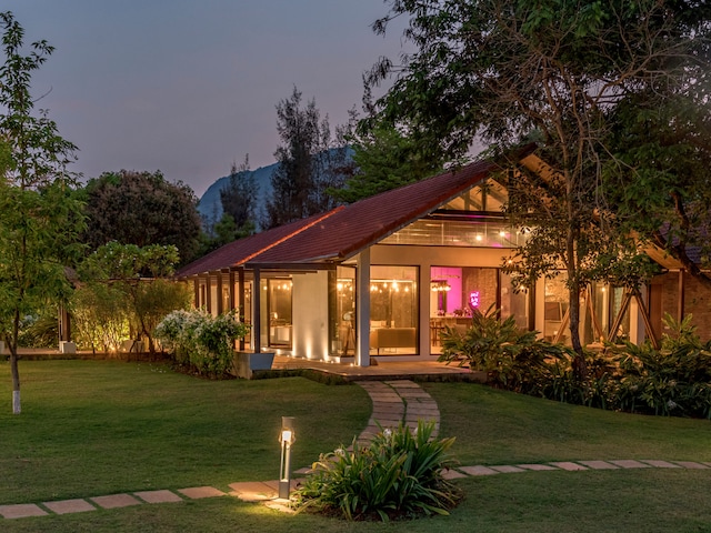 Perched on a picturesque estate overlooking Thukarwadi Lake, SaffronStays Moira is a luxurious 6-bedroom pool villa in Kamshet spread across 5 acres of lush landscapes