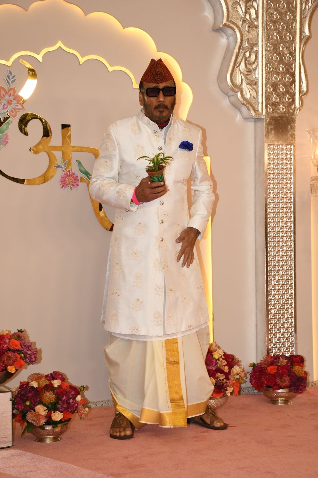 'Apna bhidu' Jackie Shroff poses for the paps at Anant Ambani and Radhika Merchant's wedding venue, with his classic plant in hand pose. (Image: Viral Bhayani) 'Apna bhidu' Jackie Shroff poses for the paps at Anant Ambani and Radhika Merchant's wedding venue, with his classic plant in hand pose. (Image: Viral Bhayani)