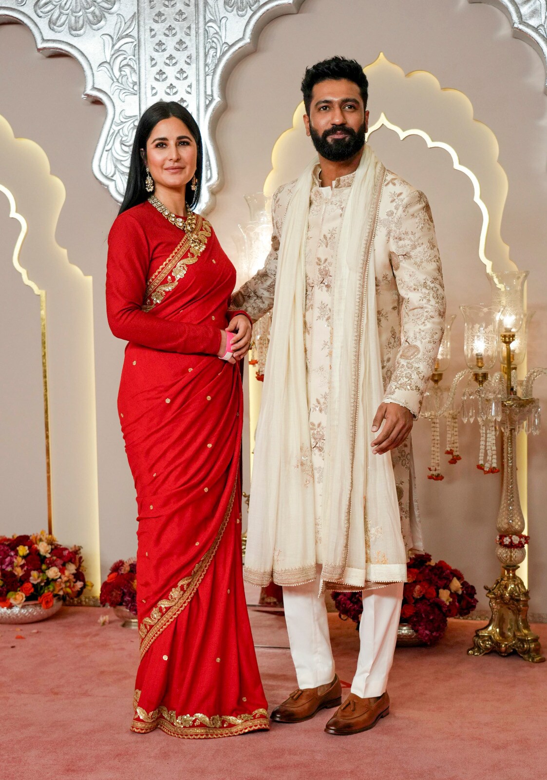 Katrina Kaif and Vicky Kaushal have opted for the traditional red saree and white kurta-pajama couple look for the auspicious event. (Image: AP) Katrina Kaif and Vicky Kaushal have opted for the traditional red saree and white kurta-pajama couple look for the auspicious event. (Image: AP)