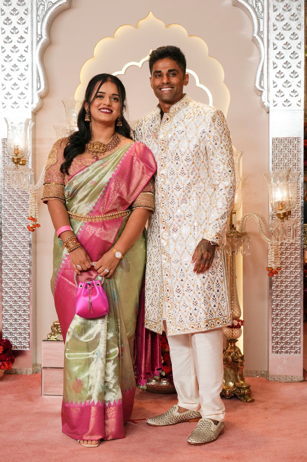 Suryakumar Yadav poses for a photograph with his wife Devisha Shetty at Bandra's Jio World Convention Centre. (Image: AP) Suryakumar Yadav poses for a photograph with his wife Devisha Shetty at Bandra's Jio World Convention Centre. (Image: AP)