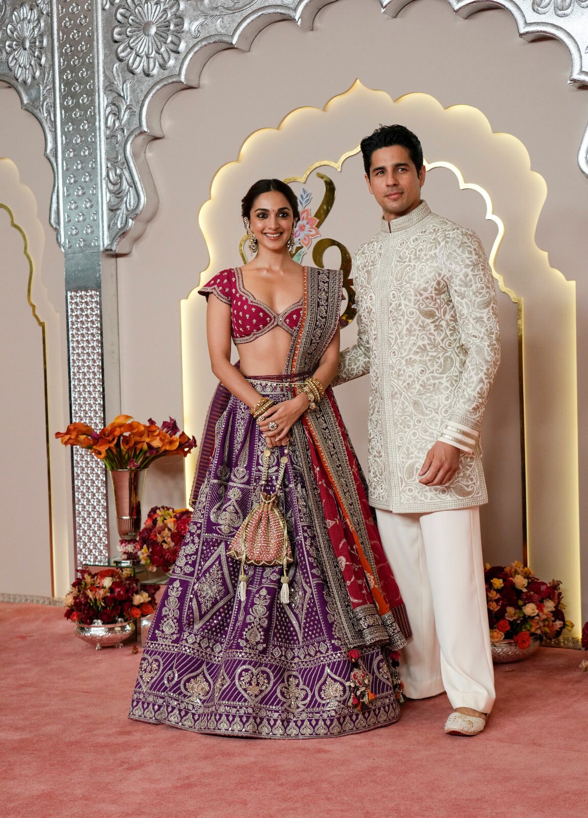 The 'Shershah'-couple, Siddharth Malhotra, and Kiara Advani arrive in beautiful outfits, perfectly complimenting each other. (Image: AP) The 'Shershah'-couple, Siddharth Malhotra, and Kiara Advani arrive in beautiful outfits, perfectly complimenting each other. (Image: AP)