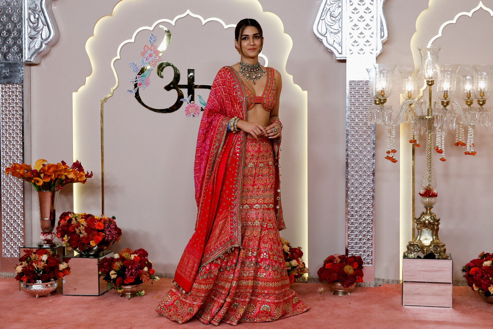Kriti Sanon looks stunning in a vibrant designer lehenga with a matching plunging-neckline blouse. (Image: Reuters) Kriti Sanon looks stunning in a vibrant designer lehenga with a matching plunging-neckline blouse. (Image: Reuters)