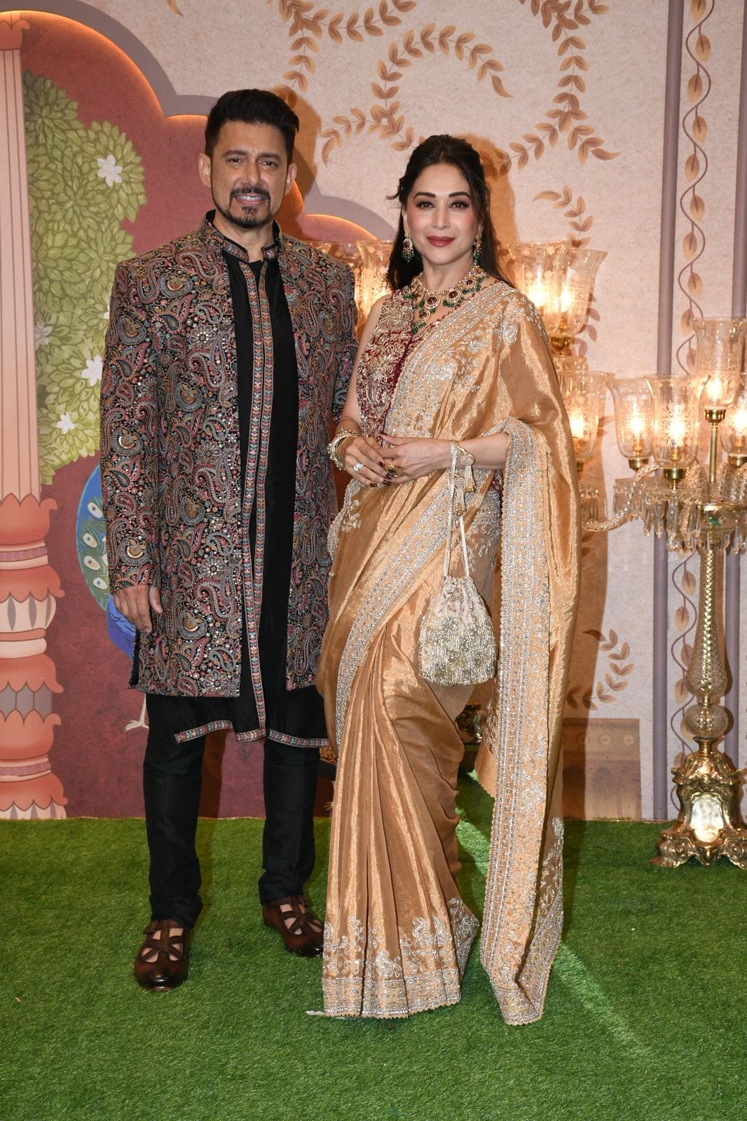 Madhuri Dixit and Dr. Ram Nene were one of the earliest guests to arrive today. (Image: Viral Bhayani) Anant Ambani-Radhika Merchant wedding
