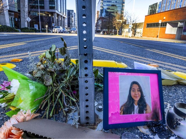 A photo of Jaahnavi Kandula, a student from Andhra Pradesh, is displayed with flowers after she was struck by a police patrol car in Seattle, US, last year. (Image: AP/File)