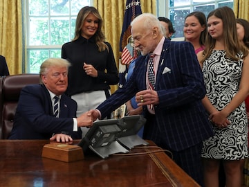 Donald Trump greets Buzz Aldrin during an Apollo 11 50th anniversary commemoration event in the Oval Office of the White House in Washington, U.S., July 19, 2019. (Reuters)