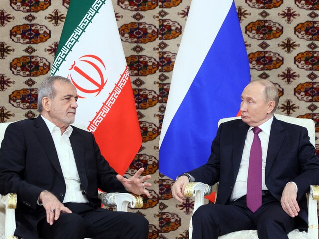 Vladimir Putin meets Iranian counterpart Masoud Pezeshkian in Ashgabat, Turkmenistan October 11, 2024. (Sputnik/Alexander Scherbak/Pool via Reuters)