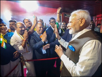 PM Modi interacting with the Indian community after his arrival in Nigeria. (Narendra Modi/X)