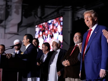 Republican presidential nominee former President Donald Trump, right, looks on as local Muslim leaders speak during a campaign rally. (AP file photo)