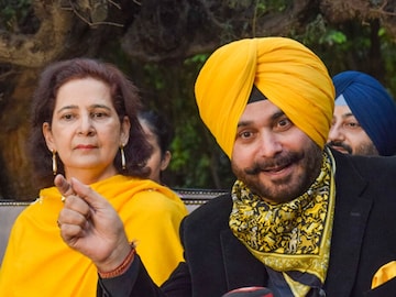 Congress leader Navjot Singh Sidhu and his wife Navjot Kaur Sidhu attend a press conference in Amritsar. (PTI Photo)