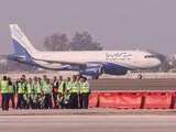 Airport officials pose for a photograph after the successful landing of the first test flight at Noida International Airport, at Jewar in Gautam Buddha Nagar district, Uttar Pradesh, Monday, Dec. 9, 2024. (PTI Photo) Airport officials pose for a photograph after the successful landing of the first test flight at Noida International Airport, at Jewar in Gautam Buddha Nagar district, Uttar Pradesh, Monday, Dec. 9, 2024. (PTI Photo)