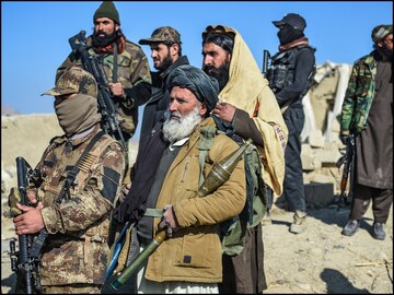 Taliban security personnel stand guard at the site two days after air strikes by Pakistan in Afghanistan's Paktika province. (AFP)