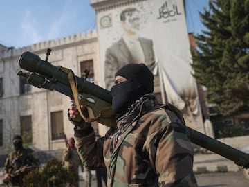 Syrian rebel groups storm Damascus, take over capital (AP Image)