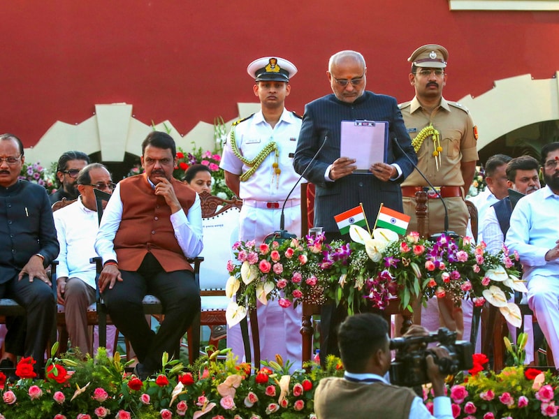 Maharashtra Governor CP Radhakrishnan, Chief Minister Devendra Fadnavis, Deputy Chief Ministers Ajit Pawar and Eknath Shinde and others during the swearing-in ceremony of cabinet ministers amid state cabinet expansion, at Raj Bhavan, in Nagpur, Sunday, Dec. 15, 2024. The 10-day-old BJP-led Mahayuti alliance ministry in Maharashtra was expanded at Nagpur on Sunday, with 39 ministers being sworn in (PTI) Maharashtra Governor CP Radhakrishnan, Chief Minister Devendra Fadnavis, Deputy Chief Ministers Ajit Pawar and Eknath Shinde and others during the swearing-in ceremony of cabinet ministers amid state cabinet expansion, at Raj Bhavan, in Nagpur, Sunday, Dec. 15, 2024. The 10-day-old BJP-led Mahayuti alliance ministry in Maharashtra was expanded at Nagpur on Sunday, with 39 ministers being sworn in (PTI)