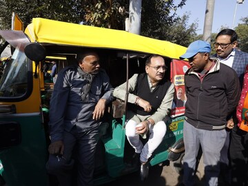 Delhi BJP president Virendra Sachdeva speaks with auto drivers over tea at the Nizamuddin Railway Station on Wednesday. (Image/X)