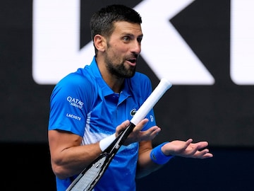 Novak Djokovic of Serbia reacts during his second round match against Jaime Faria of Portugal at the Australian Open tennis championship in Melbourne, Australia, Wednesday, Jan. 15, 2025. (AP Photo/Vincent Thian)   
