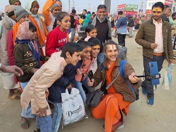 Swami Ram Shankar Maharaj, famously known as ‘Digital Baba’, strides confidently with an Apple IPhone 16 Max Pro, Apple 2024 MacBook Pro M4 Max, a tripod and a Rode wireless microphone. (News18) Swami Ram Shankar Maharaj, famously known as ‘Digital Baba’, strides confidently with an Apple IPhone 16 Max Pro, Apple 2024 MacBook Pro M4 Max, a tripod and a Rode wireless microphone. (News18)