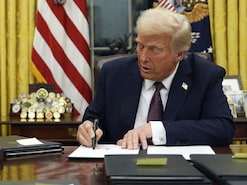 President Donald Trump signs an executive order in the Oval Office of the White House. (IMAGE: AP PHOTO) President Donald Trump signs an executive order in the Oval Office of the White House. (IMAGE: AP PHOTO)