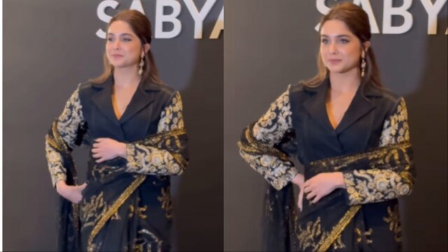 Sharvari's black saree featured golden floral embellishments. 