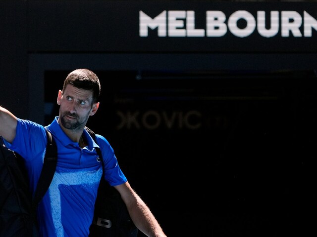 Novak Djokovic of Serbia gestures as he leaves Rod Laver Arena. (AP Photo)
