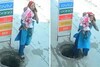 In Shocking Video, Woman Distracted By Phone Call Falls Into Open Manhole With Baby